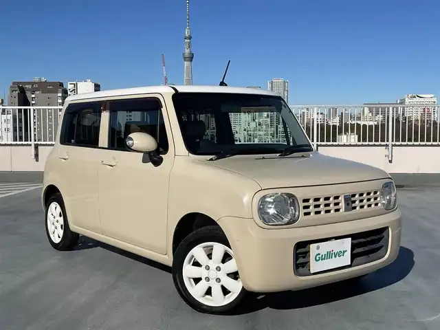 スズキ ラパン X 東京都 2009(平21)年 8.6万km ベージュⅡ 純正CDデッキ/純正１４インチアルミ/エンジンプッシュボタン/スマートキー/バイザー・マット/ABS/Wエアバック/取説