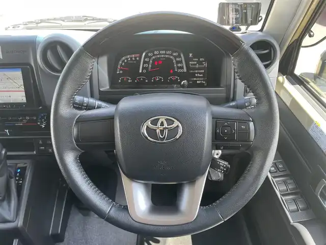 トヨタ ランドクルーザー AX 栃木県 2024(令6)年 0.7万km ベージュ ワンオーナー/AUTHORセキュリティ/carrozzeriaナビ（BT/フルセグTV/FM/AM/CD/DVD)/バックカメラ/クルーズコントロール/セーフティセンス/LEDヘッドランプ/純正フロアマット/ETC/ドライブレコーダー/背面タイヤ/リモコンキー/スペアキー（１本）/保障証/取扱説明書