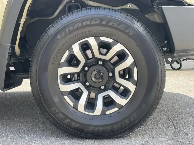 トヨタ ランドクルーザー AX 栃木県 2024(令6)年 0.7万km ベージュ ワンオーナー/AUTHORセキュリティ/carrozzeriaナビ（BT/フルセグTV/FM/AM/CD/DVD)/バックカメラ/クルーズコントロール/セーフティセンス/LEDヘッドランプ/純正フロアマット/ETC/ドライブレコーダー/背面タイヤ/リモコンキー/スペアキー（１本）/保障証/取扱説明書