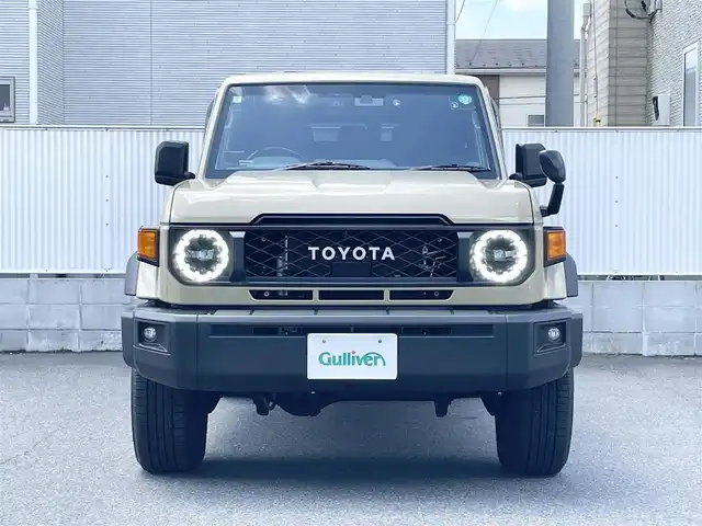 トヨタ ランドクルーザー AX 栃木県 2024(令6)年 0.7万km ベージュ ワンオーナー/AUTHORセキュリティ/carrozzeriaナビ（BT/フルセグTV/FM/AM/CD/DVD)/バックカメラ/クルーズコントロール/セーフティセンス/LEDヘッドランプ/純正フロアマット/ETC/ドライブレコーダー/背面タイヤ/リモコンキー/スペアキー（１本）/保障証/取扱説明書