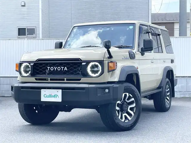 トヨタ ランドクルーザー AX 栃木県 2024(令6)年 0.7万km ベージュ ワンオーナー/AUTHORセキュリティ/carrozzeriaナビ（BT/フルセグTV/FM/AM/CD/DVD)/バックカメラ/クルーズコントロール/セーフティセンス/LEDヘッドランプ/純正フロアマット/ETC/ドライブレコーダー/背面タイヤ/リモコンキー/スペアキー（１本）/保障証/取扱説明書