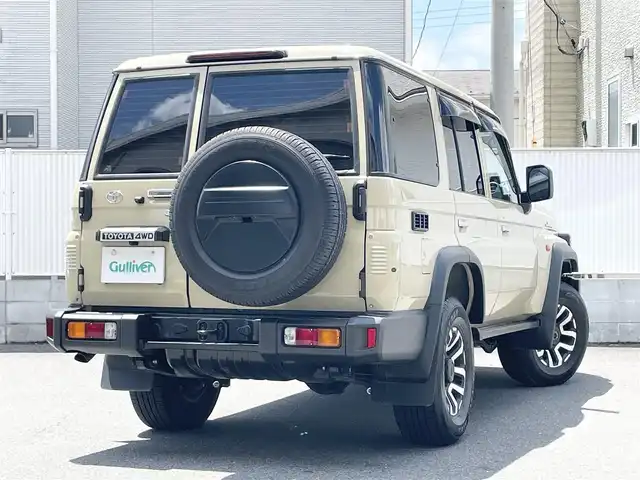 トヨタ ランドクルーザー AX 栃木県 2024(令6)年 0.7万km ベージュ ワンオーナー/AUTHORセキュリティ/carrozzeriaナビ（BT/フルセグTV/FM/AM/CD/DVD)/バックカメラ/クルーズコントロール/セーフティセンス/LEDヘッドランプ/純正フロアマット/ETC/ドライブレコーダー/背面タイヤ/リモコンキー/スペアキー（１本）/保障証/取扱説明書