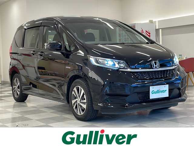 ホンダ フリード ハイブリット G ホンダセンシング 岐阜県 2022(令4)年 1.2万km クリスタルブラックパール 社外10型フローティングナビ/CN-F1X10LD/フルセグ視聴/バックモニター/CD/DVD/両側電動スライドドア/ホンダセンシング/追従クルーズコントロール/LEDヘッドライト/オートライト/純正15インチアルミホイール/プッシュスタート/スマートキー/前後ドライブレコーダー/USBオート/ETC/アイドリングストップ/ハーフレザーシート/シートヒーター/純正フロアマット