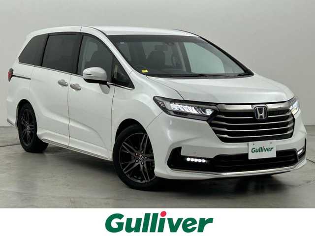 ホンダ オデッセイ ハイブリッド e:HEVアブソルート EX 福岡県 2021(令3)年 4.6万km プラチナホワイトパール 後席モニター　/純正ナビ　/全方位カメラ　/ＥＴＣ２．０　/ＡＣＣ　/コーナーセンサー　/衝突被害軽減ブレーキ　/レーンキープ　/ＢＳＭ　/パーキングアシスト　/両側電動スライドドア　/パワーバックドア　/Ｗエアコン　/ＬＥＤ