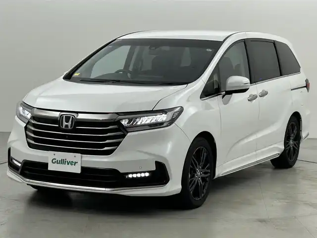ホンダ オデッセイ ハイブリッド e:HEVアブソルート EX 福岡県 2021(令3)年 4.6万km プラチナホワイトパール 後席モニター　/純正ナビ　/全方位カメラ　/ＥＴＣ２．０　/ＡＣＣ　/コーナーセンサー　/衝突被害軽減ブレーキ　/レーンキープ　/ＢＳＭ　/パーキングアシスト　/両側電動スライドドア　/パワーバックドア　/Ｗエアコン　/ＬＥＤ