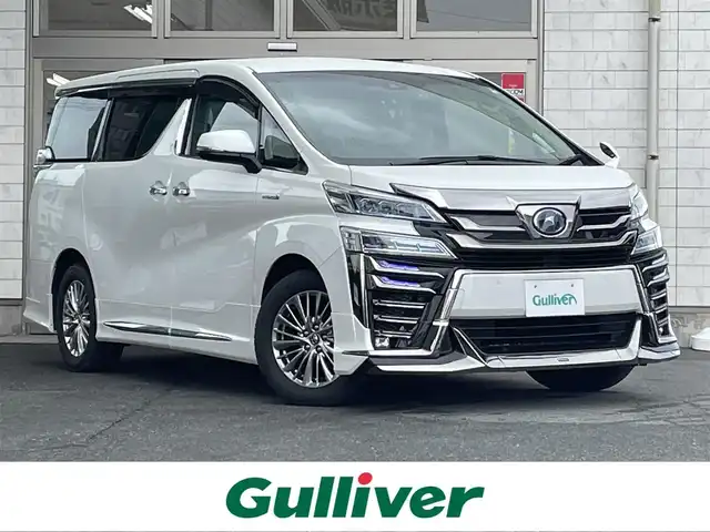 トヨタ ヴェルファイア ハイブリット ZR Gエディション 岩手県 2018(平30)年 4.8万km ホワイトパールクリスタルシャイン 4WD/フルエアロ（モデリスタ）/純正10インチナビ/前方ドライブレコーダー/純正フリップダウンモニター/トヨタセーフティーセンス/・レーントレーシングアシスト/・クリアランスソナー/・パーキングサポートブレーキ/・プリクラッシュセーフティー/・ロードサインアシスト/両側パワースライドドア/アダプティブクルーズコントロール/パワーバックドア/パワーシート/シートメモリー/全席シートヒーター/D/N席シートエアコン/ステアリングスイッチ/ステアリングヒーター/AC100V電源/デジタルインナーミラー/三眼LEDヘッドライト/LEDフォグランプ/オートライト/アダプティブハイビーム/LEDコーナリングランプ/LEDシーケンシャルターンランプ/AM/FM/CD/DVD/USB/HDMI/Bluetooth/ビルトインETC2.0/純正17インチアルミホイール/純正フロアマット/プッシュスタート/スマートキー/スペアキー/保証書/取扱説明書