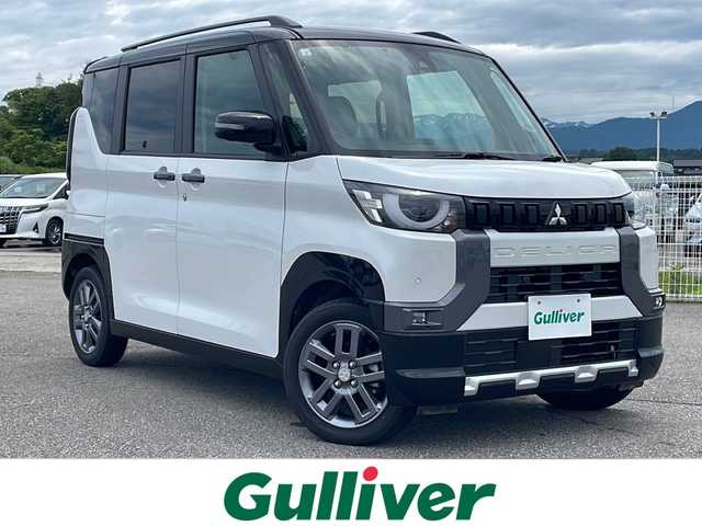 三菱 デリカミニ 富山県 2024(令6)年 0.5万km パール 純正ＳＤ９インチナビ　/フルセグ　/両側電動スライドドア　/衝突軽減装置　/全方位カメラ　/禁煙車　/バックカメラ　/コーナーセンサー　/４WD　/LEDヘッドライト　/レーダークルーズコントロール　/スマートキー　/シートヒーター/純正アルミホイール/純正オーディオ/ウィンカーミラー/電動格納ミラー/ワンオーナー/ETC/プッシュスタート