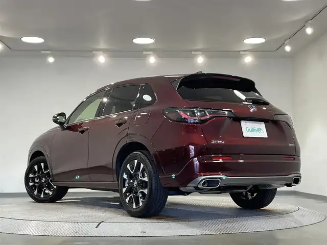 ホンダ ＺＲ－Ｖ ハイブリッド e:HEV Z 愛知県 2023(令5)年 1.5万km ワイン 純正９インチホンダコネクトディスプレー　/（AM/FM/Bluetooth/フルセグTV/CarPlay/USB)/マルチビューカメラ　/ホンダセンシング　/　　-衝突軽減ブレーキ（CMBS)/　　-誤発進抑制機能/　　-路外逸脱抑制機能/　　-渋滞追従機能付アダプティブクルーズコントロール（ACC）/　　-先行車発進お知らせ機能　/　　-標識認識機能/　　-オートハイビーム/　　-ブラインドスポットインフォメーション/　　-パーキングセンサーシステム/ビルトインＥＴＣ２．０　/LEDヘッドライト/シートヒーター/ステアリングヒーター　/電動バックドア　/ドライブレコーダー　/置くだけ充電　/電動パワーシート　/パドルシフト