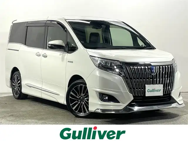 トヨタ エスクァイア ハイブリッド Gi プレミアムパッケージ 大阪府 2017(平29)年 5.4万km ホワイトパールクリスタルシャイン モデリスタエアロ 純正10incナビ(フルセグ/DVD再生/Bluetooth) バックカメラ 後席モニター ETC ハーフレザー シート＆ハンドルヒーター 衝突軽減 クルコン トヨタセーフティセンス