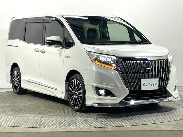 トヨタ エスクァイア ハイブリッド Gi プレミアムパッケージ 大阪府 2017(平29)年 5.4万km ホワイトパールクリスタルシャイン モデリスタエアロ 純正10incナビ(フルセグ/DVD再生/Bluetooth) バックカメラ 後席モニター ETC ハーフレザー シート＆ハンドルヒーター 衝突軽減 クルコン トヨタセーフティセンス