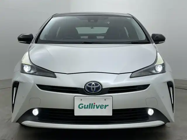 トヨタ プリウス S ツーリングセレ ブラックED 岡山県 2021(令3)年 3.8万km プラチナホワイトパールマイカ 純正８インチディスプレイオーディオ/ＡＣ１００Ｖ電源/ビルトインＥＴＣ/ドライブレコーダー（前/後）/バックカメラ/追従型クルーズコントロール/合皮シート/シートヒーター（運転席/助手席）/衝突軽減ブレーキ/コーナーセンサー（前/後）/LEDヘッドライト/オートライト/オートハイビーム/フォグランプ/禁煙車/純正17インチAW/スマートキー×1/新車保証書/スペアキー×１