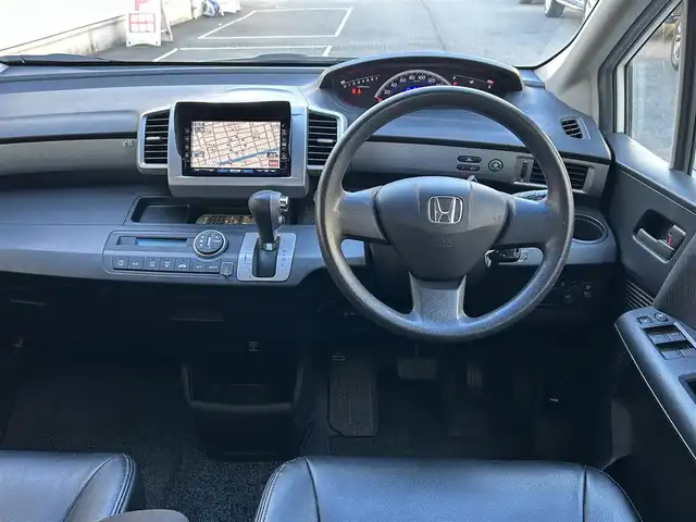 ホンダ フリード FLEX 愛知県 2011(平23)年 12.2万km プレミアムホワイトパール ワンオーナー/左リアパワースライドア/純正HDDナビ〈VXH-112VS〉/・DVD／ワンセグTV/バックカメラ/アンテナ分離型ETC/前方ドライブレコーダー〈FT-DR100S〉/社外レザー調シートカバー/社外15インチAW