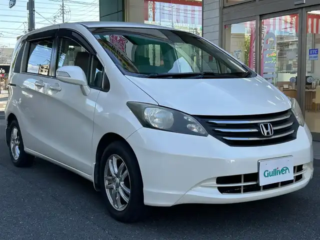 ホンダ フリード FLEX 愛知県 2011(平23)年 12.2万km プレミアムホワイトパール ワンオーナー/左リアパワースライドア/純正HDDナビ〈VXH-112VS〉/・DVD／ワンセグTV/バックカメラ/アンテナ分離型ETC/前方ドライブレコーダー〈FT-DR100S〉/社外レザー調シートカバー/社外15インチAW