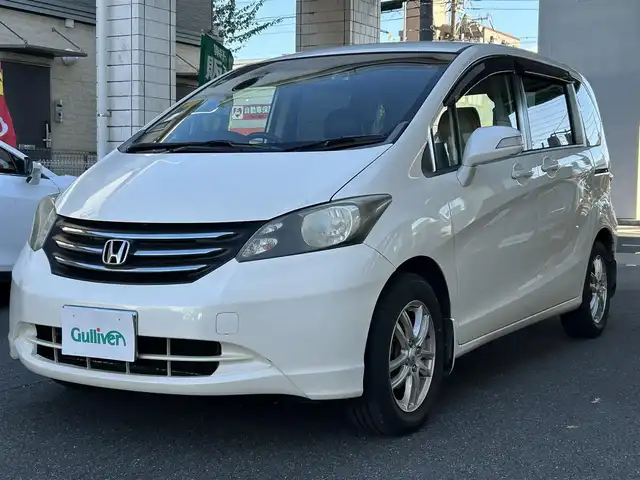 ホンダ フリード FLEX 愛知県 2011(平23)年 12.2万km プレミアムホワイトパール ワンオーナー/左リアパワースライドア/純正HDDナビ〈VXH-112VS〉/・DVD／ワンセグTV/バックカメラ/アンテナ分離型ETC/前方ドライブレコーダー〈FT-DR100S〉/社外レザー調シートカバー/社外15インチAW