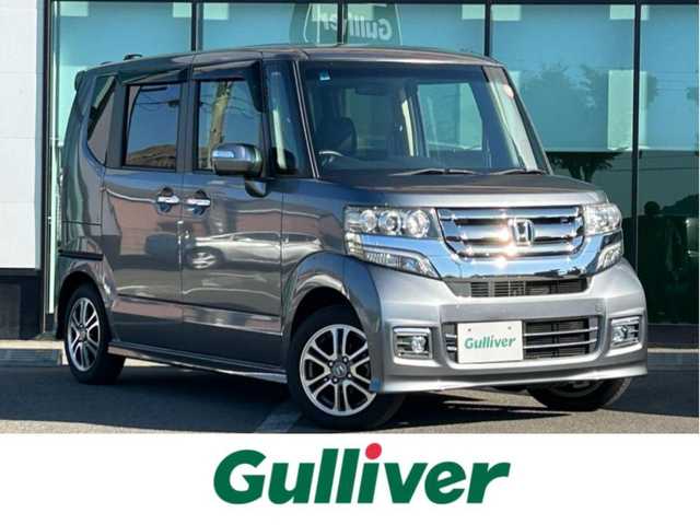 ホンダ Ｎ ＢＯＸ カスタム SSパッケージ 和歌山県 2017(平29)年 1.1万km シャイニンググレーM 純正ナビ/(AM/FM/CD/DVD/Bluetooth/TV)/バックカメラ/横滑り防止機能/シートヒーター/オートライト/両側パワースライドドア/ビルトインETC/ECON/ステアリングスイッチ/パワーウインドウ/プッシュスタート/スマートキー/電動格納ミラー/純正AW