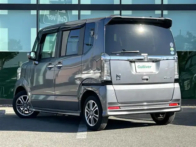 ホンダ Ｎ ＢＯＸ カスタム SSパッケージ 和歌山県 2017(平29)年 1.1万km シャイニンググレーM 純正ナビ/(AM/FM/CD/DVD/Bluetooth/TV)/バックカメラ/横滑り防止機能/シートヒーター/オートライト/両側パワースライドドア/ビルトインETC/ECON/ステアリングスイッチ/パワーウインドウ/プッシュスタート/スマートキー/電動格納ミラー/純正AW