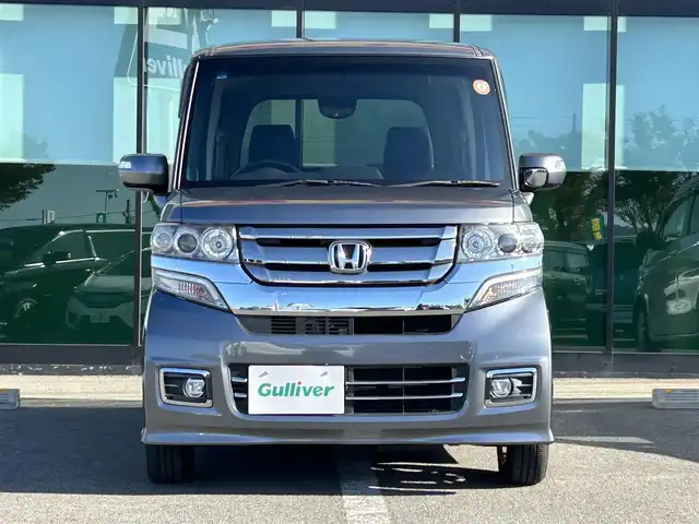 ホンダ Ｎ ＢＯＸ カスタム SSパッケージ 和歌山県 2017(平29)年 1.1万km シャイニンググレーM 純正ナビ/(AM/FM/CD/DVD/Bluetooth/TV)/バックカメラ/横滑り防止機能/シートヒーター/オートライト/両側パワースライドドア/ビルトインETC/ECON/ステアリングスイッチ/パワーウインドウ/プッシュスタート/スマートキー/電動格納ミラー/純正AW