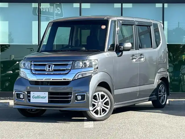 ホンダ Ｎ ＢＯＸ カスタム SSパッケージ 和歌山県 2017(平29)年 1.1万km シャイニンググレーM 純正ナビ/(AM/FM/CD/DVD/Bluetooth/TV)/バックカメラ/横滑り防止機能/シートヒーター/オートライト/両側パワースライドドア/ビルトインETC/ECON/ステアリングスイッチ/パワーウインドウ/プッシュスタート/スマートキー/電動格納ミラー/純正AW