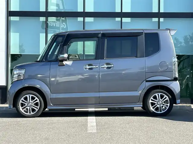 ホンダ Ｎ ＢＯＸ カスタム SSパッケージ 和歌山県 2017(平29)年 1.1万km シャイニンググレーM 純正ナビ/(AM/FM/CD/DVD/Bluetooth/TV)/バックカメラ/横滑り防止機能/シートヒーター/オートライト/両側パワースライドドア/ビルトインETC/ECON/ステアリングスイッチ/パワーウインドウ/プッシュスタート/スマートキー/電動格納ミラー/純正AW