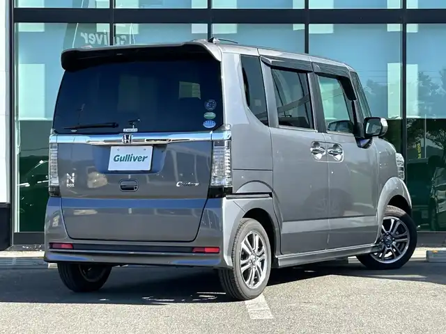 ホンダ Ｎ ＢＯＸ カスタム SSパッケージ 和歌山県 2017(平29)年 1.1万km シャイニンググレーM 純正ナビ/(AM/FM/CD/DVD/Bluetooth/TV)/バックカメラ/横滑り防止機能/シートヒーター/オートライト/両側パワースライドドア/ビルトインETC/ECON/ステアリングスイッチ/パワーウインドウ/プッシュスタート/スマートキー/電動格納ミラー/純正AW