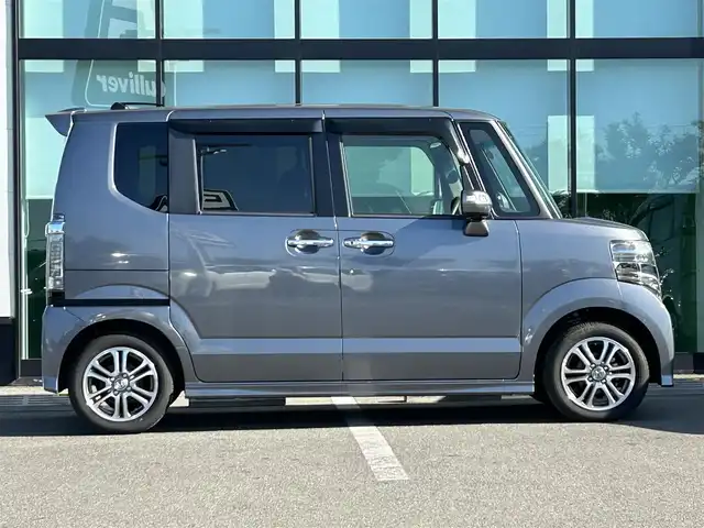 ホンダ Ｎ ＢＯＸ カスタム SSパッケージ 和歌山県 2017(平29)年 1.1万km シャイニンググレーM 純正ナビ/(AM/FM/CD/DVD/Bluetooth/TV)/バックカメラ/横滑り防止機能/シートヒーター/オートライト/両側パワースライドドア/ビルトインETC/ECON/ステアリングスイッチ/パワーウインドウ/プッシュスタート/スマートキー/電動格納ミラー/純正AW