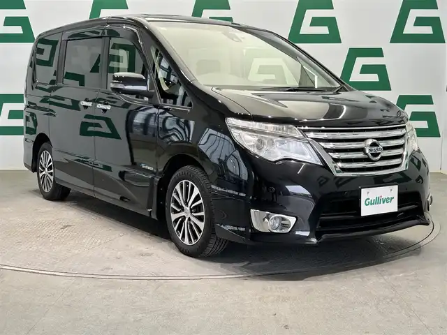 日産 セレナ HWS S HV Vセレ +Sefty Aセーフ 鹿児島県 2015(平27)年 7万km ダイヤモンドブラック 純正フリップダウンモニター/インテリジェントアラウンドビューモニター/クルーズコントロール/インテリジェントエマージェンシーストップ/純正SDナビ【MM514D-L】/（CD/DVD/フルセグ/BT/SD/AUX）/ビルトインETC/社外前後ドライブレコーダー【ZDR016】/両側パワースライドドア/純正HIDヘッドライト/オートライト/電動格納ミラー/純正フロアマット/純正15インチアルミ/純正ドアバイザー/後席ロール式サンシェード/シートバックテーブル/フロント&バックソナー