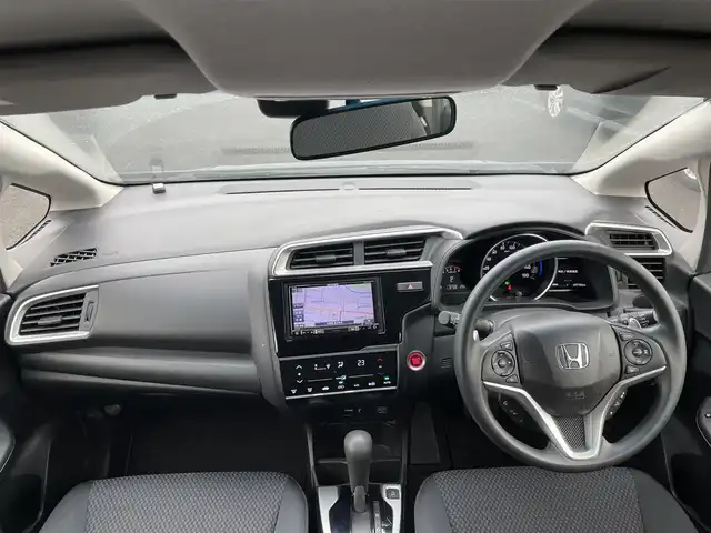 ホンダ フィット 13G S ホンダセンシング 道央・札幌 2017(平29)年 4.9万km シャイニンググレーM ワンオーナー/社外メモリナビ/AM/FM/BT/SD/DVD/フルセグ/ホンダセンシング/衝突被害軽減ブレーキ/横滑り防止装置/アダプティブクルーズコントロール/レーンキープアシスト/バックカメラ/ビルトインETC/アイドリングストップ/ECON/ステアリングリモコン/パドルシフト/MTモード付AT/プッシュスタート/スマートキー/LEDヘッドライト/オートライト/フォグランプ/電動格納ミラー/ウィンカーミラー/純正フロアマット/ドアバイザー/スペアキー/純正エンジンスターター/社外AW付冬タイヤ積込/175/70/R14/2024年/山7mm