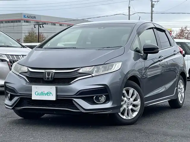 ホンダ フィット 13G S ホンダセンシング 道央・札幌 2017(平29)年 4.9万km シャイニンググレーM ワンオーナー/社外メモリナビ/AM/FM/BT/SD/DVD/フルセグ/ホンダセンシング/衝突被害軽減ブレーキ/横滑り防止装置/アダプティブクルーズコントロール/レーンキープアシスト/バックカメラ/ビルトインETC/アイドリングストップ/ECON/ステアリングリモコン/パドルシフト/MTモード付AT/プッシュスタート/スマートキー/LEDヘッドライト/オートライト/フォグランプ/電動格納ミラー/ウィンカーミラー/純正フロアマット/ドアバイザー/スペアキー/純正エンジンスターター/社外AW付冬タイヤ積込/175/70/R14/2024年/山7mm