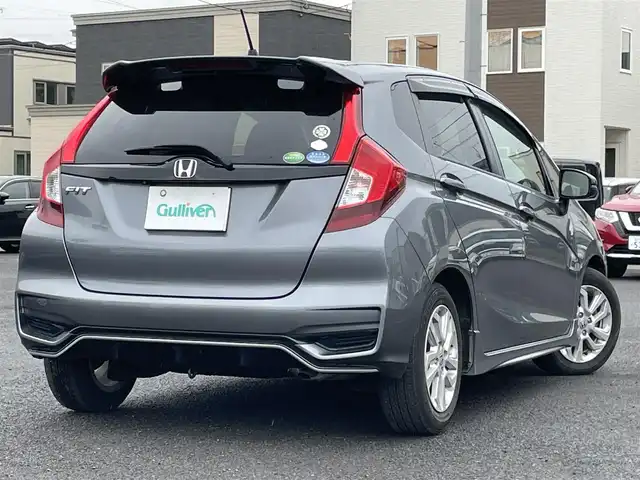 ホンダ フィット 13G S ホンダセンシング 道央・札幌 2017(平29)年 4.9万km シャイニンググレーM ワンオーナー/社外メモリナビ/AM/FM/BT/SD/DVD/フルセグ/ホンダセンシング/衝突被害軽減ブレーキ/横滑り防止装置/アダプティブクルーズコントロール/レーンキープアシスト/バックカメラ/ビルトインETC/アイドリングストップ/ECON/ステアリングリモコン/パドルシフト/MTモード付AT/プッシュスタート/スマートキー/LEDヘッドライト/オートライト/フォグランプ/電動格納ミラー/ウィンカーミラー/純正フロアマット/ドアバイザー/スペアキー/純正エンジンスターター/社外AW付冬タイヤ積込/175/70/R14/2024年/山7mm