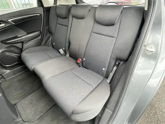 ホンダ フィット 13G S ホンダセンシング 道央・札幌 2017(平29)年 4.9万km シャイニンググレーM ワンオーナー/社外メモリナビ/AM/FM/BT/SD/DVD/フルセグ/ホンダセンシング/衝突被害軽減ブレーキ/横滑り防止装置/アダプティブクルーズコントロール/レーンキープアシスト/バックカメラ/ビルトインETC/アイドリングストップ/ECON/ステアリングリモコン/パドルシフト/MTモード付AT/プッシュスタート/スマートキー/LEDヘッドライト/オートライト/フォグランプ/電動格納ミラー/ウィンカーミラー/純正フロアマット/ドアバイザー/スペアキー/純正エンジンスターター/社外AW付冬タイヤ積込/175/70/R14/2024年/山7mm