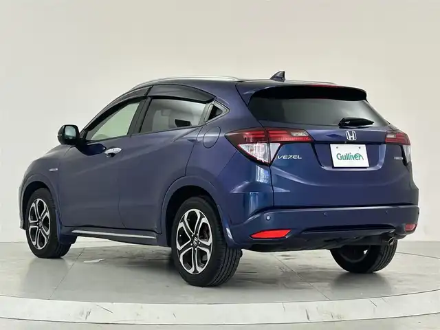 ホンダ ヴェゼル ハイブリッド Z ホンダセンシング 大阪府 2016(平28)年 5.9万km モルフォブルーP ホンダセンシング/　・衝突被害軽減システム/　・レーンキープアシスト/　・前後パーキングセンサーシステム/　・電動パーキングブレーキ/　・オートブレーキホールド/　・アダプティブクルーズコントロール/社外メモリナビ/　　CD/DVD/BT/USB/フルセグTV/バックカメラ/LEDオートライト/フォグランプ/合皮ハーフレザーシート/シートヒーター/純正17インチアルミホイール/パドルシフト/スマートキー/ETC