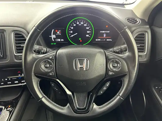 ホンダ ヴェゼル ハイブリッド Z ホンダセンシング 大阪府 2016(平28)年 5.9万km モルフォブルーP ホンダセンシング/　・衝突被害軽減システム/　・レーンキープアシスト/　・前後パーキングセンサーシステム/　・電動パーキングブレーキ/　・オートブレーキホールド/　・アダプティブクルーズコントロール/社外メモリナビ/　　CD/DVD/BT/USB/フルセグTV/バックカメラ/LEDオートライト/フォグランプ/合皮ハーフレザーシート/シートヒーター/純正17インチアルミホイール/パドルシフト/スマートキー/ETC