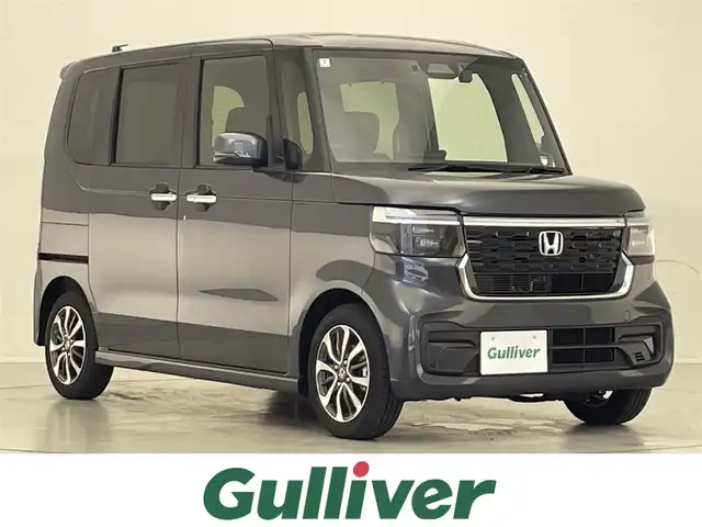 ホンダ Ｎ ＢＯＸ カスタム 滋賀県 2024(令6)年 0.2万km メテオロイドグレーメタリック 禁煙車/純正9インチナビ/(CD/DVD/フルセグ/Bluetooth)/バックカメラ/コーナーセンサー/ETC/片側電動/レーダークルコン/シートヒーター(D/N)/前方ドラレコ/ステアリングスイッチ/LEDヘッドライト/オートライト/スマートキー/プッシュスタート/スペアキー
