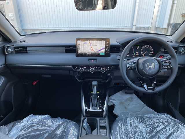 ホンダ ヴェゼル ハイブリッド e:HEV Z 石川県 2025(令7)年 0.1千km 黒 登録済未使用車　純正９型ナビ　フルセグＴＶ　バックカメラ　ＬＥＤヘッドライト　ＥＴＣ２．０　純正アルミ　パワーバックドア　ホンダセンシング　シートヒーター　レーダークルーズ　ワイヤレス充電　保証書