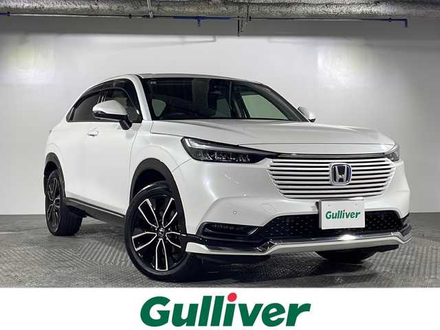 ホンダ ヴェゼル ハイブリッド e:HEV Z 沖縄県 2021(令3)年 3.2万km プラチナホワイトパール ワンオーナー/禁煙車　/純正9インチホンダコネクトナビ/（フルセグTV Bluetooth Apple CarPlay）/ホンダセンシング/・衝突被害軽減ブレーキ/・アダプティブクルーズコントロール/・車線逸脱警報機能/BSM（ブラインドスポットモニター）/バックカメラ/置くだけ充電/前後ドライブレコーダー/ETC2.0/ダウンヒルアシスト/ハーフレザーシート/シートヒーター