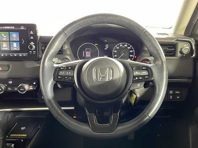 ホンダ ヴェゼル ハイブリッド e:HEV Z 沖縄県 2021(令3)年 3.2万km プラチナホワイトパール ワンオーナー/禁煙車　/純正9インチホンダコネクトナビ/（フルセグTV Bluetooth Apple CarPlay）/ホンダセンシング/・衝突被害軽減ブレーキ/・アダプティブクルーズコントロール/・車線逸脱警報機能/BSM（ブラインドスポットモニター）/バックカメラ/置くだけ充電/前後ドライブレコーダー/ETC2.0/ダウンヒルアシスト/ハーフレザーシート/シートヒーター