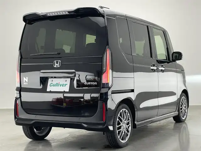 ホンダ Ｎ ＢＯＸ カスタム ターボ 愛知県 2024(令6)年 0.4万km クリスタルブラックパール 純正９型ナビ　シートヒーター　両側パワスラ　バックカメラ　フルセグＴＶ　追従クルコン　ＥＴＣ　ホンダセンシング　パドルシフト　黒ハーフレザー　コーナーセンサー　衝突軽減　ＬＥＤライト　ＵＳＢ接続　禁煙　オートハイビーム　車線逸脱　純正フロアマット　純正１５インチAW　プッシュスタート　スマートキー