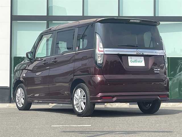 スズキ ソリオ HV MX 和歌山県 2024(令6)年 4.5万km メロウディープレッドパール デュアルカメラブレーキサポート/車線逸脱防止機能/レーダークルーズコントロール/パーキングソナー/左側パワースライドドア/運転席シートヒーター/オートライト/ヘッドライトレベライザー/リアドアサンシェード/純正15インチAW/ドアバイザー/プッシュスタート/スマートキー