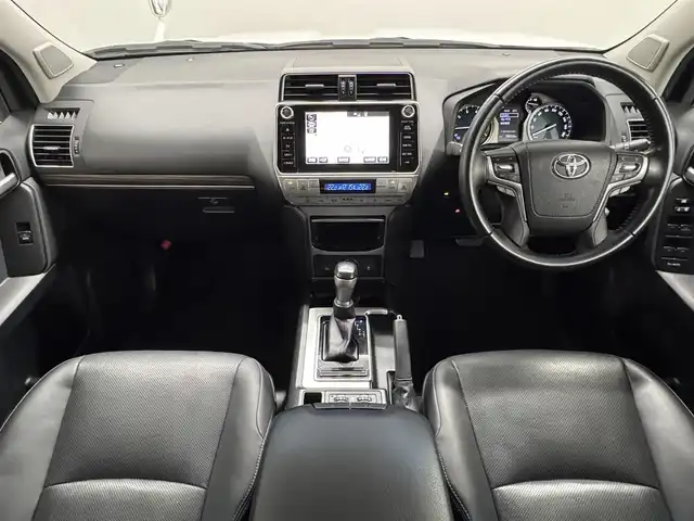 トヨタ ランドクルーザー プラド TX Lパッケージ 三重県 2020(令2)年 6万km ホワイトパールクリスタルシャイン ガソリン/パートタイム4WD/MTモード付フロア6AT/【OP】純正 8インチナビ /（AM/FM/CD/DVD/Blu-ray/SDREC/SD/USB/Bluetooth/AUX/TV）/バックカメラ/ドライブレコーダー 前方/ビルトイン ETC2.0/Toyota Safety Sense/・プリクラッシュセーフティ［PCS］/・レーンディパーチャーアラート［LDA］/・レーダークルコン/・オートハイビーム［AHB］/・【OP】クリアランスソナー＆バックソナー/・トラクションコントロールシステム/装備/・【OP】電動ムーンルーフ/・【OP】ルーフレール（ブラック）/・本革シート（ブラック）/・シートヒーター/ベンチレーション（D/N）/・パワーシート（D8way&ランバーサポート/N4way）/・オートライト/・LED ヘッドランプ＆フロントフォグランプ/・ヘッドライトウォッシャー/・ステアリングスイッチ/・雨滴感応式フロントワイパー/・【OP】純正19inAW/・プッシュスタート/・スマートキーx2/・保/取/ナビ取/など