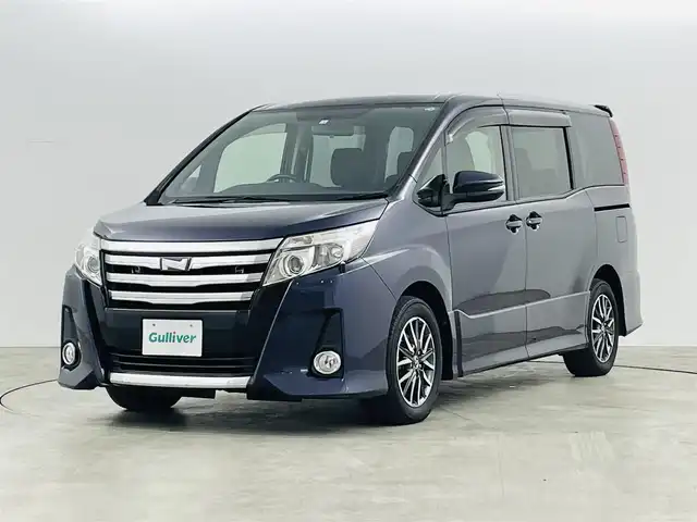 トヨタ ノア Si 福島県 2014(平26)年 5.4万km ダークバイオレットマイカメタリック トヨタセーフティセンスC/・プリクラッシュセーフティ/・レーンディパーチャーアラート/・オートマチックハイビーム/・先行車発進お知らせ機能/純正7インチナビ/・ワンセグTV/BT/SD/CD/DVD/FM/AM/・バックカメラ/・ビルトインETC/・後席フリップダウンモニター/革張りステアリング/・ステアリングスイッチ/電動格納ミラー/・ウィンカーミラー/LEDヘッドライト/・オートライト/・フォグランプ/純正フロアマット/ドアバイザー