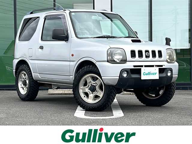 スズキ ジムニー XG 岐阜県 2001(平13)年 15.8万km シルキーシルバーメタリック 登録時走行距離157387km/ルーフレール/背面タイヤ/オーディオ/リモコンキー/布系シート/フルフラットシート/純正フロアマット/エアコン/ハロゲンヘッドライト/エアバッグ運転席・助手席/パワーウィンドウ／パワーステアリング