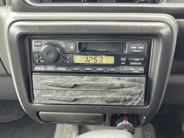 スズキ ジムニー XG 岐阜県 2001(平13)年 15.8万km シルキーシルバーメタリック 登録時走行距離157387km/ルーフレール/背面タイヤ/オーディオ/リモコンキー/布系シート/フルフラットシート/純正フロアマット/エアコン/ハロゲンヘッドライト/エアバッグ運転席・助手席/パワーウィンドウ／パワーステアリング