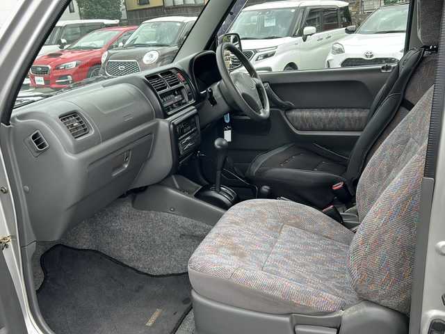 スズキ ジムニー XG 岐阜県 2001(平13)年 15.8万km シルキーシルバーメタリック 登録時走行距離157387km/ルーフレール/背面タイヤ/オーディオ/リモコンキー/布系シート/フルフラットシート/純正フロアマット/エアコン/ハロゲンヘッドライト/エアバッグ運転席・助手席/パワーウィンドウ／パワーステアリング