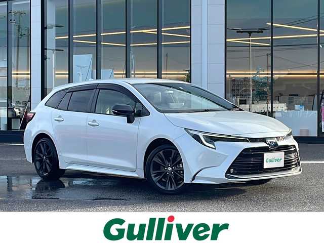 トヨタ カローラツーリング ハイブリッド ダブルバイビー 新潟県 2023(令5)年 6.5万km プラチナホワイトパールマイカ 純正ナビ（BT/DTV/FM/AM/フルセグ）/前席シートヒーター/ステアリングヒーター/オートライト/ハーフレザーシート/ETC2.0/ステアリングスイッチ/パーキングアシスト/フォグランプ/電動格納ウィンカーミラー/ドアバイザー