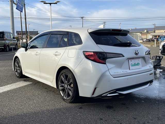 トヨタ カローラツーリング ハイブリッド ダブルバイビー 新潟県 2023(令5)年 6.5万km プラチナホワイトパールマイカ 純正ナビ（BT/DTV/FM/AM/フルセグ）/前席シートヒーター/ステアリングヒーター/オートライト/ハーフレザーシート/ETC2.0/ステアリングスイッチ/パーキングアシスト/フォグランプ/電動格納ウィンカーミラー/ドアバイザー