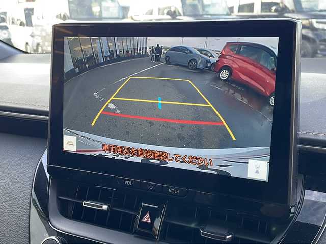 トヨタ カローラツーリング ハイブリッド ダブルバイビー 新潟県 2023(令5)年 6.5万km プラチナホワイトパールマイカ 純正ナビ（BT/DTV/FM/AM/フルセグ）/前席シートヒーター/ステアリングヒーター/オートライト/ハーフレザーシート/ETC2.0/ステアリングスイッチ/パーキングアシスト/フォグランプ/電動格納ウィンカーミラー/ドアバイザー