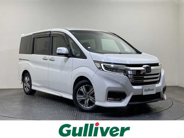 ホンダ ステップワゴン スパーダ eHEV G EXホンダS 愛媛県 2021(令3)年 6.4万km プラチナホワイトパール Hondaインターナビ＋リンクアップフリー/＋ETC2.0車載器（ナビゲーション連動）/純正10インチ/Bluetooth フルセグTV DVD再生可/バックカメラ//ホンダセンシング/アダプティブクルーズコントロール/レーンアシスト/ナビ装着用スペシャルパッケージ/＋ETC2.0車載器/わくわくゲート/運転席&助手席シートヒーター/アクティブコーナーライト/ハーフレザーシート/LEDオートライト/ステアリングリモコン/ハーフレザーシート