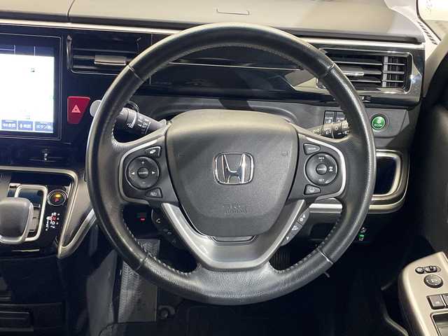 ホンダ ステップワゴン スパーダ eHEV G EXホンダS 愛媛県 2021(令3)年 6.4万km プラチナホワイトパール Hondaインターナビ＋リンクアップフリー/＋ETC2.0車載器（ナビゲーション連動）/純正10インチ/Bluetooth フルセグTV DVD再生可/バックカメラ//ホンダセンシング/アダプティブクルーズコントロール/レーンアシスト/ナビ装着用スペシャルパッケージ/＋ETC2.0車載器/わくわくゲート/運転席&助手席シートヒーター/アクティブコーナーライト/ハーフレザーシート/LEDオートライト/ステアリングリモコン/ハーフレザーシート