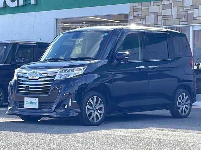トヨタ ルーミー カスタムG－T 徳島県 2017(平29)年 5.5万km ブラックマイカメタリック Panasonicナビ：CN-RA03WD/(AM/FM/DISC/SD/Bluetooth)/スマートアシスト/・衝突回避支援ブレーキ機能/・衝突警報機能/・車線逸脱警報機能/・先行車発進お知らせ機能/・コーナーセンサー/・オートハイビーム/バックカメラ/両側パワースライドドア/シートヒーター/ドライブレコーダー/ETC/純正15インチアルミホイール/プッシュスタート/スマートキー