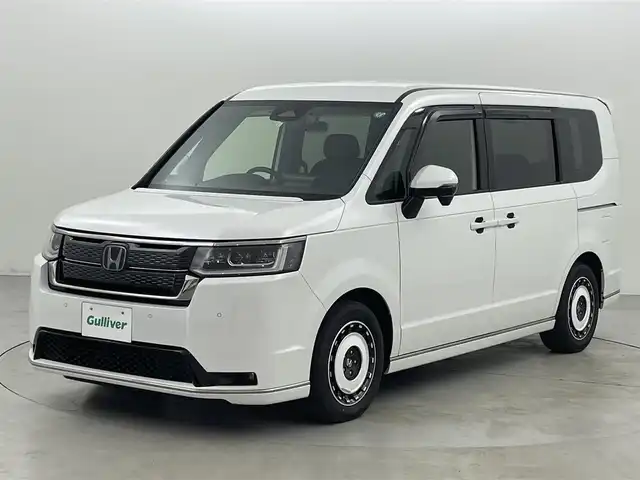 ホンダ ステップワゴン スパーダ eHEV 福岡県 2023(令5)年 3万km プラチナホワイトパール ワンオーナー　/純正１１．４型ナビ/フルセグTV　/バックカメラ　/ホンダセンシング　/レーダークルーズコントロール　/コーナーセンサー　/衝突被害軽減ブレーキ　/レーンキープ　/アクセル踏み間違い防止　/ブラインドスポットモニター/パドルシフト　/両側電動スライドドア　/ハーフレザーシート　/シートヒーター　/パワーバックドア　/ＬＥＤヘッドライト　/純正１６インチアルミホイール　/純正ＡＷ付き冬タイヤ４本積込み
